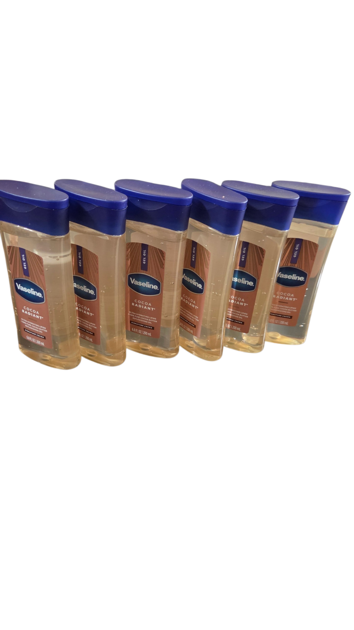 Six bottles of Vaseline lotion with blue caps on a white background